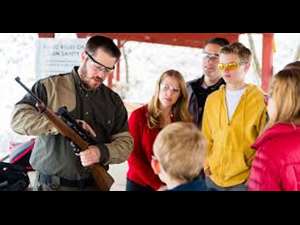 showing firearm to group